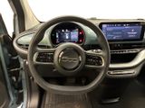 the interior of a car with a steering wheel and dashboard controls