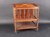 a small wooden table with a magazine rack on it