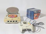 a video game system and a game controller on a table
