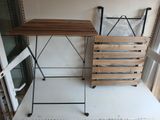 a table and a chair on the floor in a room