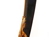 a black and gold table with a mirror on top of it