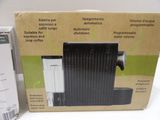 packaging of a black and white heater sitting on top of a white table