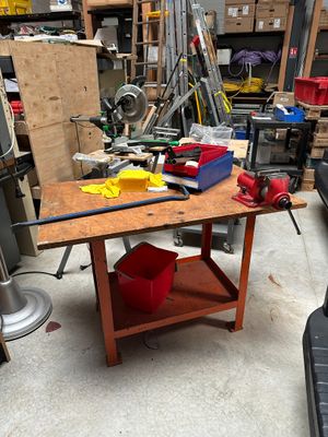 a workbench with tools on it in a garage