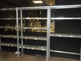 a large metal shelf with many shelves on it