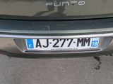 a close up of a car ' s license plate on the back of a car
