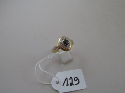 a ring with a black stone on it and a price tag attached to it