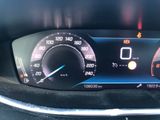 a close up of a car dashboard with a speedometer