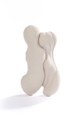 un petit objet blanc posé sur une surface blanche