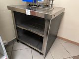 a stainless steel counter with a basket on top