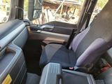 a seat in the back of a truck with a laptop on it