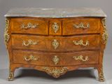a marble top chest of drawers on display