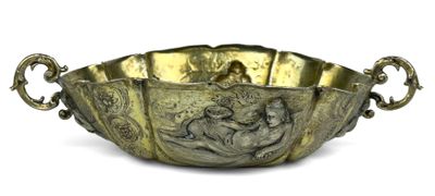 an antique brass bowl with a design of a man and a woman