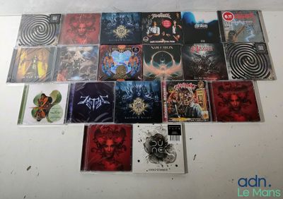 a lot of cd ' s on the table together