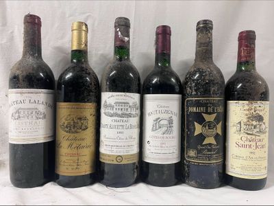 several bottles of wine are lined up in a row on a table