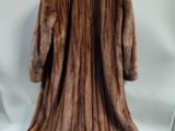 an image of a fur coat hanging on a wall
