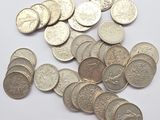 a lot of coins that are on the table