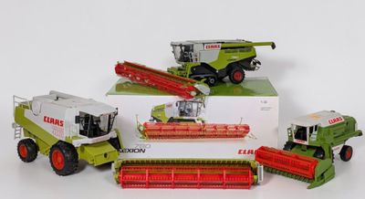 four different models of farm machinery in a box