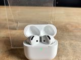 a clear box with a pair of airpods in it