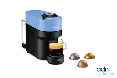 an image of a coffee maker with a cup of coffee next to it