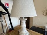 a lamp that is sitting on a table in a room