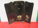 a black screen with flowers on it on a red floor