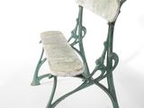 a green bench with a wooden seat on a white background
