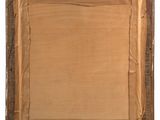 an old picture frame with a piece of paper taped around it
