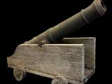 une charrette en bois surmontée d'un canon