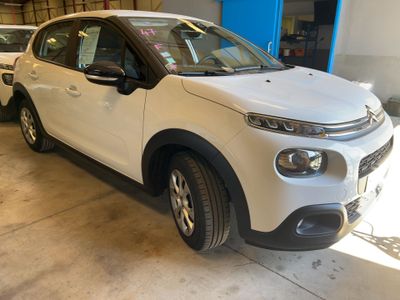a white car that is parked in a garage