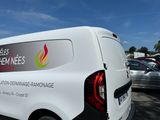 a white van that is parked in a parking lot