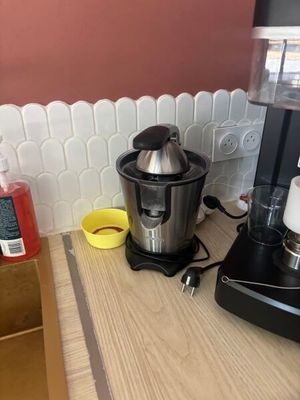a blender sitting on a counter next to a coffee maker