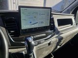a car dashboard with a laptop on the dashboard