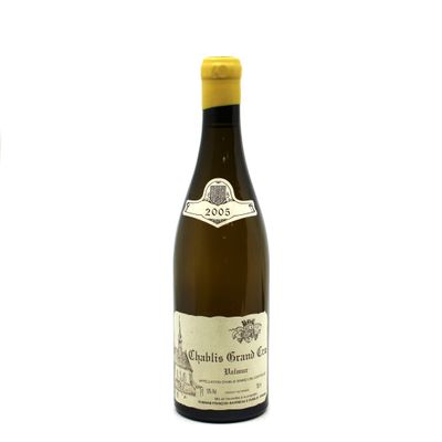 a bottle of wine sitting next to a bottle of wine