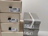 several boxes stacked on top of each other on a white surface
