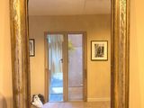 a mirror that is sitting on a table in a room