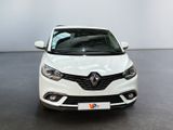 the front view of a white car parked in a showroom