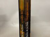 two books in a black box on a white surface