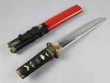 two different types of knives on a white surface