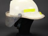 a white hard hat with a yellow tape on it
