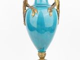 an image of a blue vase on a gold stand