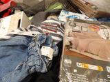 a pile of clothing that is sitting on the floor