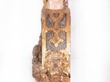 statue of a woman wearing a gold headdress and a gold crown