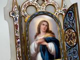 a picture of a painting of a woman holding a baby