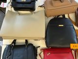 a lot of purses that are on a table
