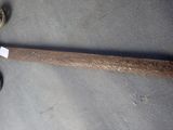 a baseball bat that is laying on the ground