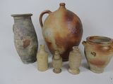 a group of vases that are sitting on a table