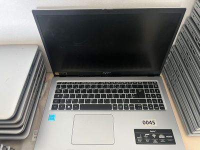 a laptop computer sitting on top of a stack of books