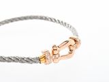 a close up of a bracelet with a clasp on a white background