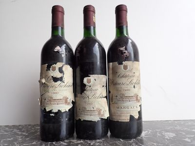 three bottles of wine that are sitting on a table