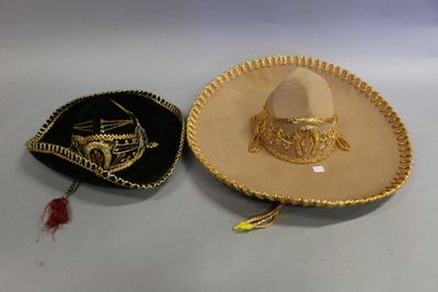 two hats that are sitting next to each other on a table
